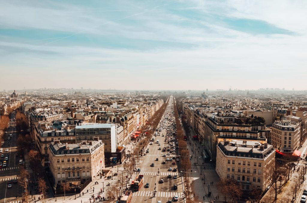 high angle view of the avenue des champs elysees under a cloudy sky and sunlight in paris